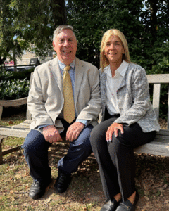 Michael Cohen and Annette Romano sitting on a bench together.